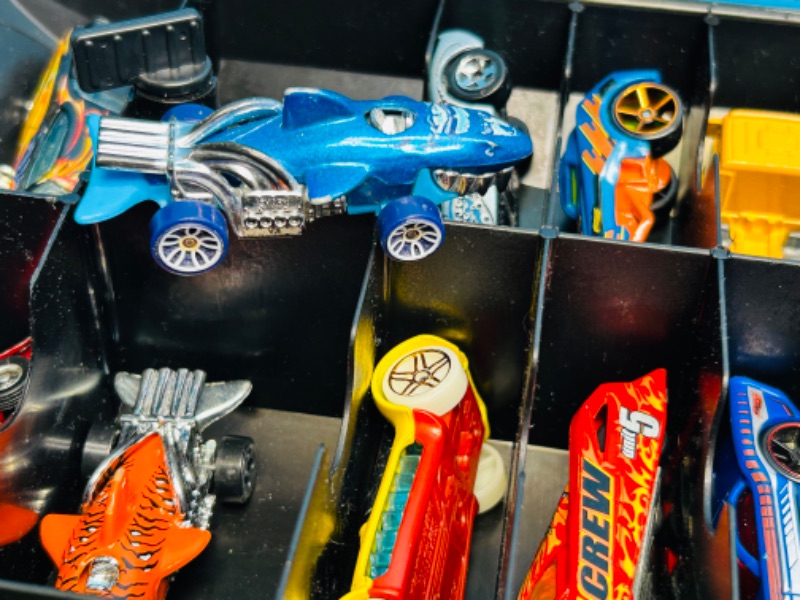 Photo 1 of 698925…70 die cast cars in hot wheels rolling case
