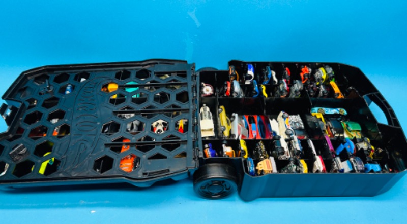 Photo 1 of 698925…70 die cast cars in hot wheels rolling case