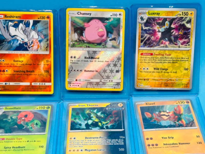 Photo 2 of 698940…8 holo and reverse holo Pokémon cards in hard plastic sleeves 