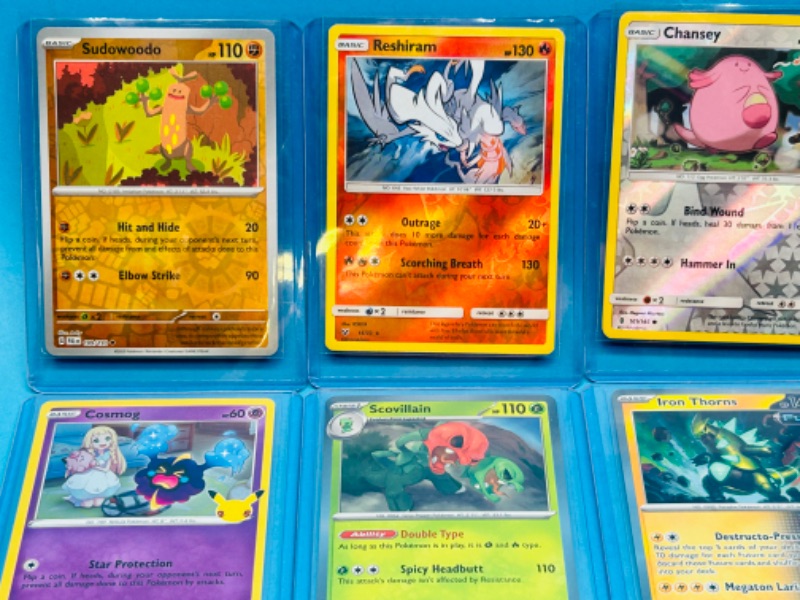 Photo 3 of 698940…8 holo and reverse holo Pokémon cards in hard plastic sleeves 