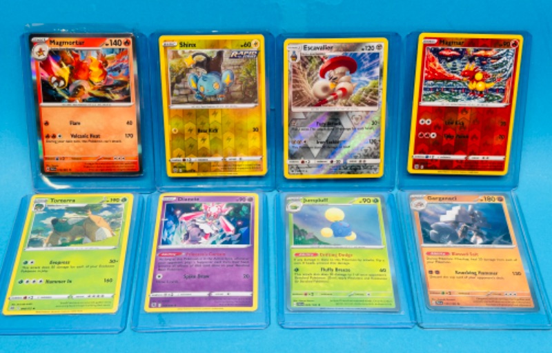 Photo 1 of 698941… 8 holo and reverse holo Pokémon cards in hard plastic sleeves 