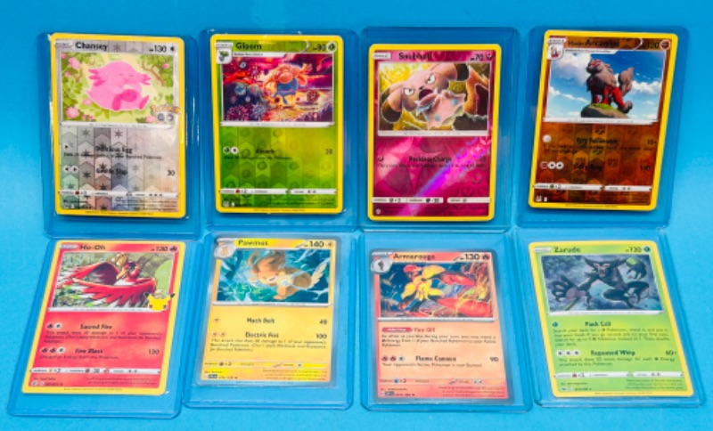 Photo 1 of 698942… 8 holo and reverse holo Pokémon cards in hard plastic sleeves 