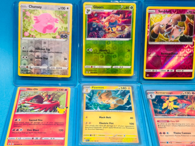 Photo 2 of 698942… 8 holo and reverse holo Pokémon cards in hard plastic sleeves 