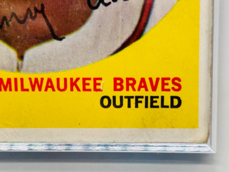 Photo 1 of 698947…1959 Hank Aaron card 380  in hard plastic case - shows swear from age