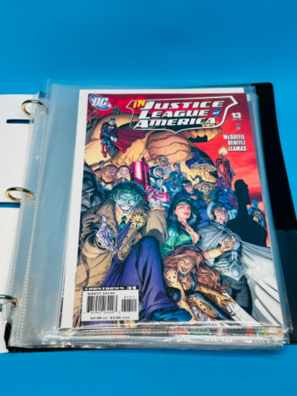 Photo 1 of 699120…10 justice league and society comics in binder-see photos 