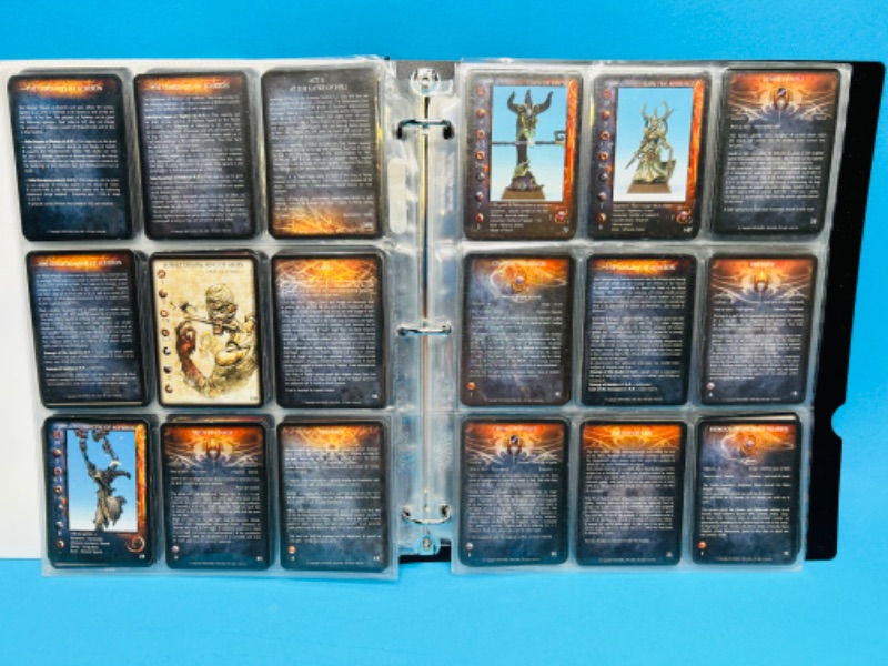 Photo 1 of 699122…80 Rackham Confrontation game cards in binder 