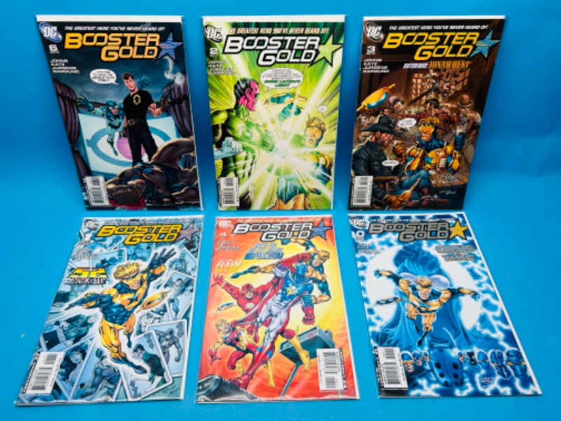 Photo 1 of 699159…6 booster gold  comics in plastic sleeves 