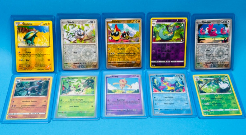 Photo 1 of 699162…10 Pokémon holo and reverse holo cards in hard plastic sleeves 