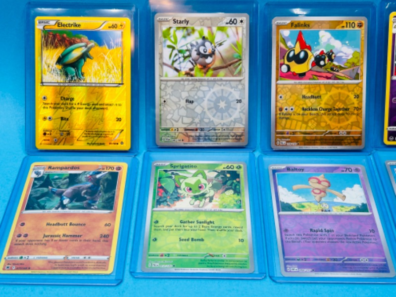 Photo 3 of 699162…10 Pokémon holo and reverse holo cards in hard plastic sleeves 