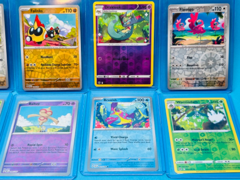 Photo 2 of 699162…10 Pokémon holo and reverse holo cards in hard plastic sleeves 