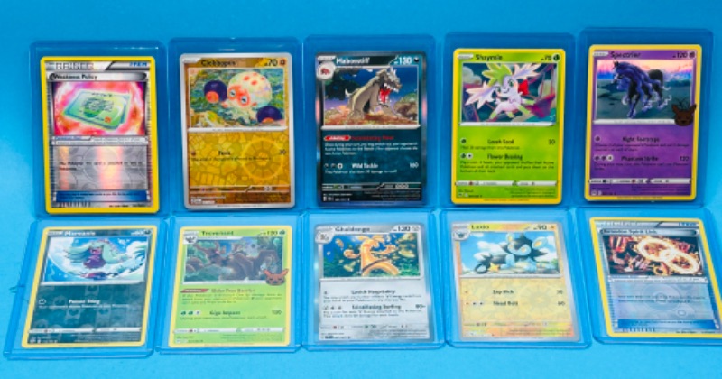 Photo 1 of 699172…10 Pokémon holo and reverse holo cards in hard plastic sleeves 