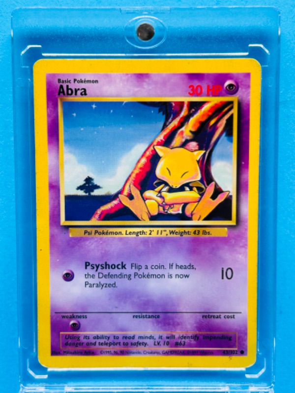 Photo 1 of 699202…Pokémon Abra card 43/102  in hard plastic case 