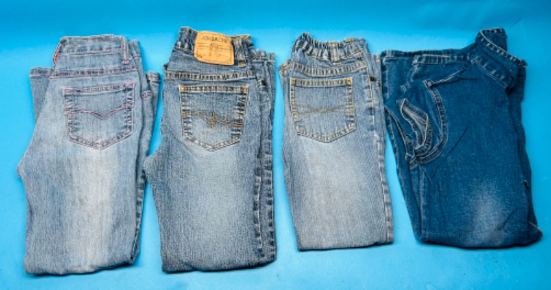 Photo 1 of 699383…4 used pairs of girls jeans and dress size 7