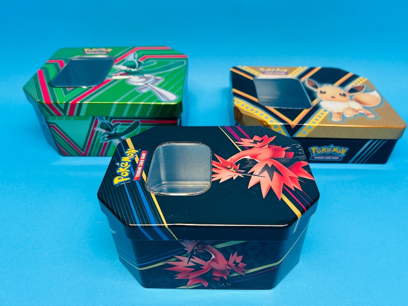 Photo 1 of 699438… 3 EMPTY Pokémon tins-empty