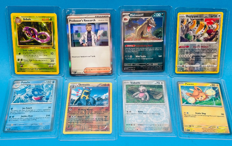 Photo 1 of 699464… 8 reverse and holo Pokémon cards in hard plastic sleeves 