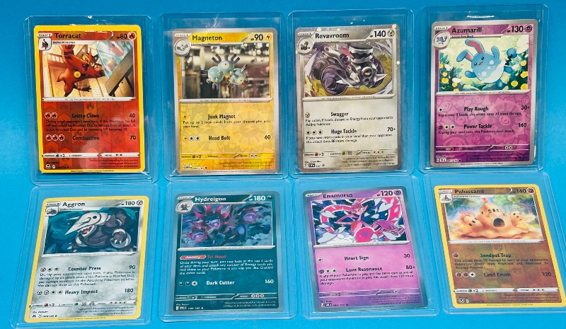 Photo 1 of 699466… 8 reverse and holo Pokémon cards in hard plastic sleeves 