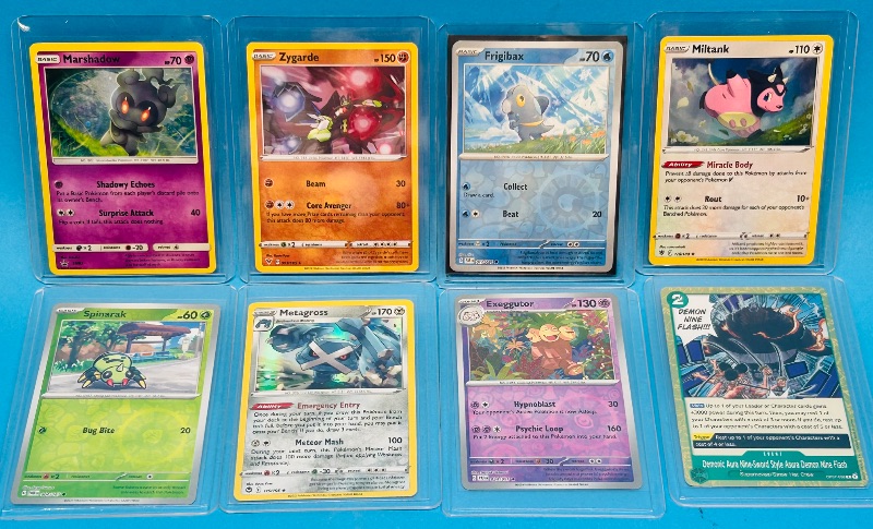 Photo 1 of 699468… 8 reverse and holo Pokémon cards in hard plastic sleeves 