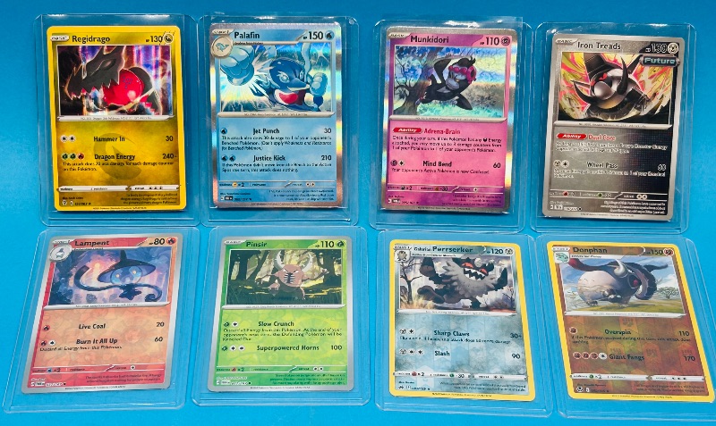 Photo 1 of 699469… 8 reverse and holo Pokémon cards in hard plastic sleeves 