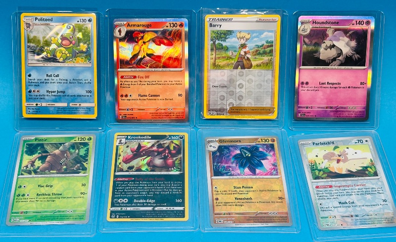 Photo 1 of 699470… 8 reverse and holo Pokémon cards in hard plastic sleeves 