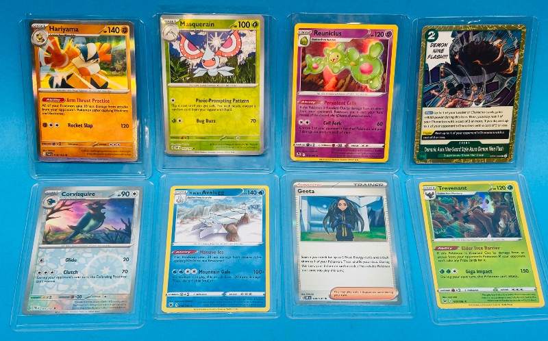 Photo 1 of 699471… 8 reverse and holo Pokémon cards in hard plastic sleeves 