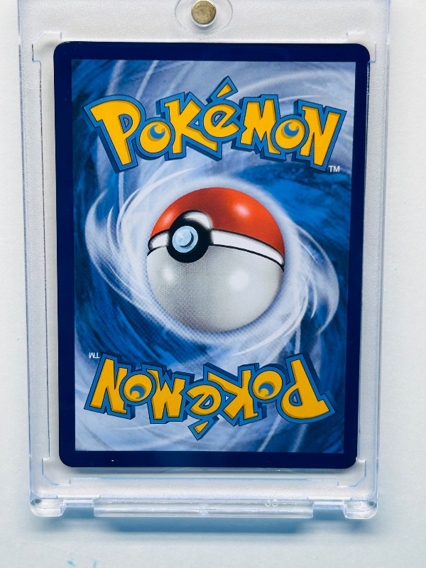 Photo 2 of 699662…Pokémon v holo card 058/203  in hard plastic case 