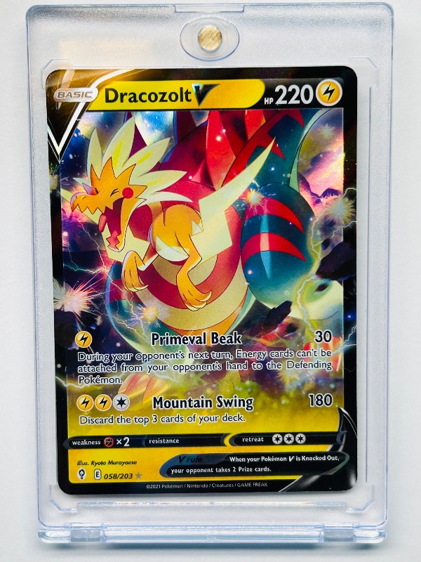 Photo 1 of 699662…Pokémon v holo card 058/203  in hard plastic case 