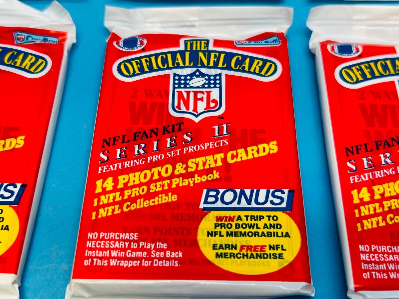 Photo 1 of 699906…final sale no returns/refunds-8 sealed NFL fan kit card packs