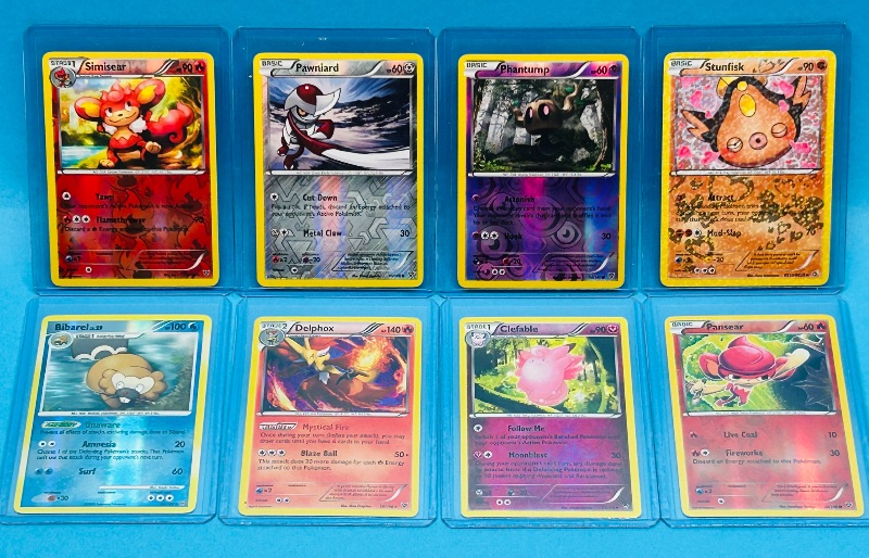 Photo 1 of 699949…8 Pokémon reverse holo cards in hard plastic sleeves 