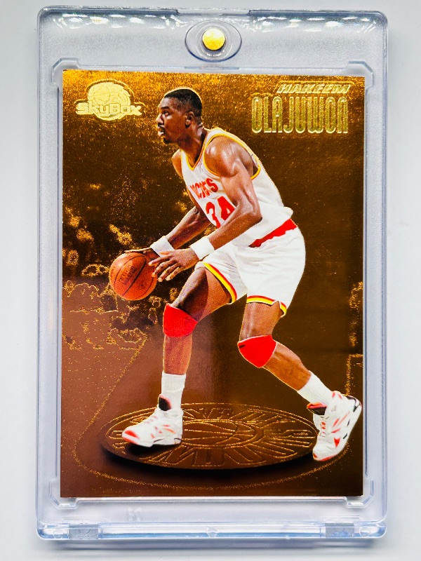 Photo 1 of 699964…skybox Hakeem Olajuwon foil card SH3  in hard plastic case