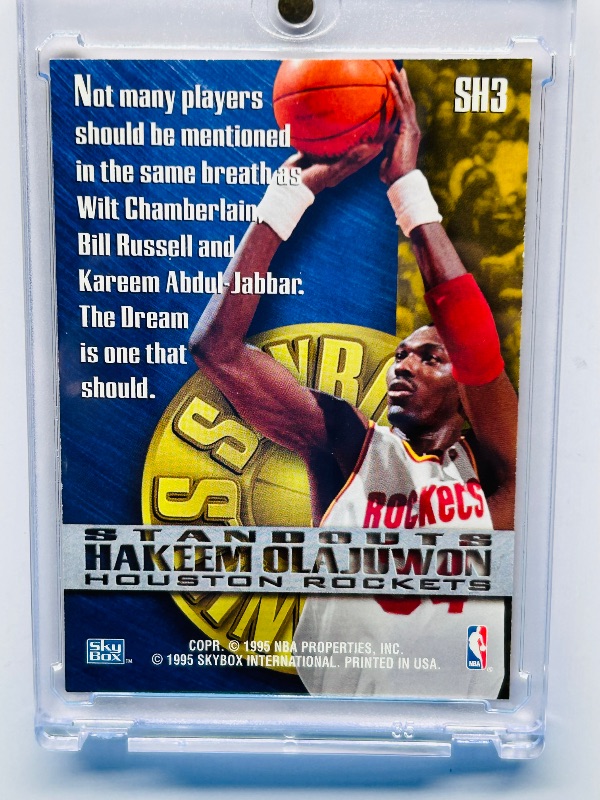 Photo 1 of 699964…skybox Hakeem Olajuwon foil card SH3  in hard plastic case