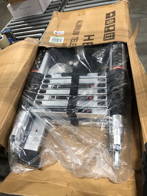 Photo 1 of aluminum telescoping ladder 