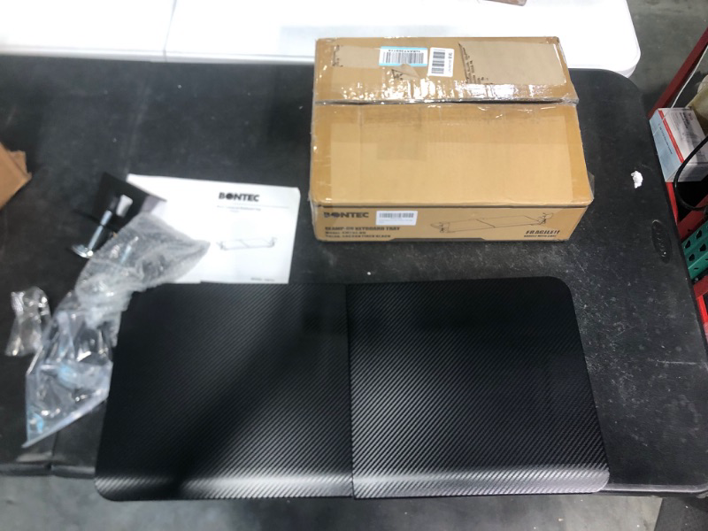 Photo 1 of BONTEC Keyboard Tray Gaming Under Desk Colored Carbon Fiber, Pull Out Keyboard & Mouse Tray with C Clamp, 25.6“x 11.8“ Steady Slide-Out Computer Drawer for Typing, Perfect for Home or Office, Black 
