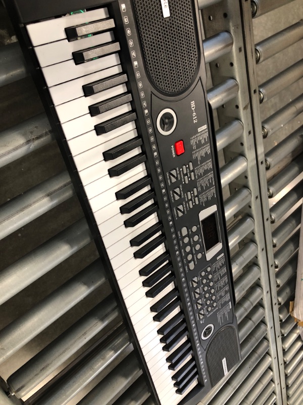 Photo 1 of 61 Keys Keyboard Piano, Electronic Digital Piano with Built-In two Speaker Microphone, With Sheet Stand and Power Supply, Portable Keyboard Gift Teaching for Beginners