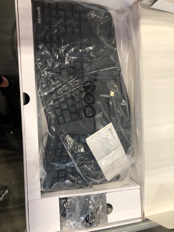 Photo 1 of Microsoft Ergonomic Desktop - Black - Wired, Comfortable, Ergonomic Keyboard and Mouse Combo, with Cushioned Wrist and Palm Support. Split Keyboard. Dedicated Office Key.