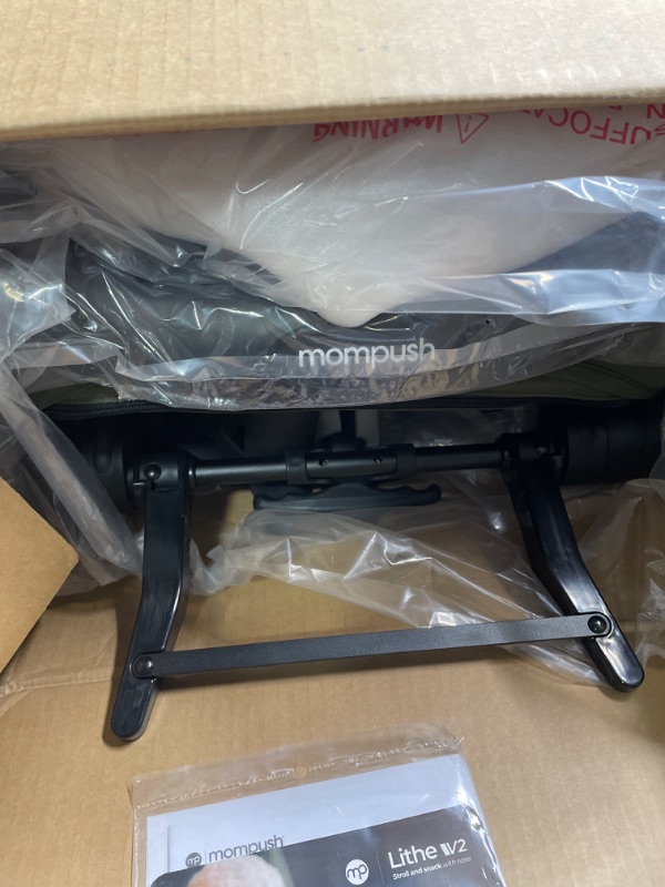 Photo 1 of Mompush Lithe V2 Lightweight Stroller + Snack Tray, Ultra-Compact Fold & Airplane Ready Travel Stroller, Near Flat Recline Seat, Cup Holder, Raincover & Travelbag Included Forest