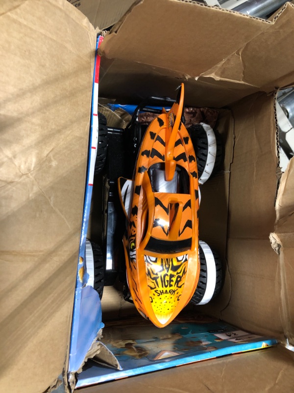 Photo 3 of Hot Wheels Monster Trucks, Remote Control Car, Monster Truck Toy with All-Terrain Wheels, 1:15 Scale Unstoppable Tiger Shark RC