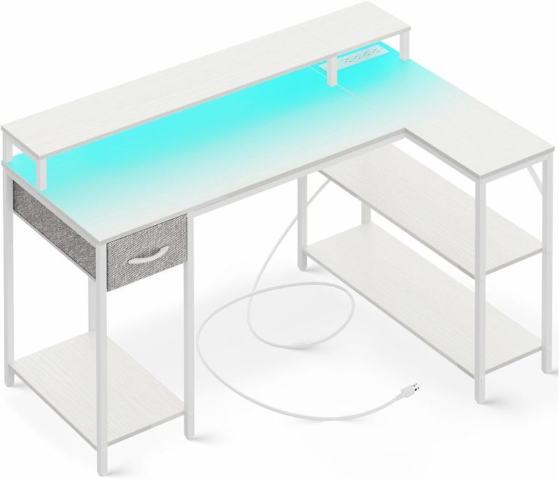 Photo 1 of SUPERJARE L Shaped Gaming Desk with LED Lights & Power Outlets, Reversible Computer Desk with Shelves & Drawer, Corner Desk Home Office Desk, White