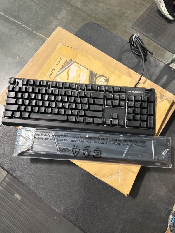 Photo 3 of SteelSeries Apex 3 TKL RGB Gaming Keyboard – Tenkeyless Compact Form Factor - 8-Zone RGB Illumination – IP32 Water & Dust Resistant – Whisper Quiet Gaming Switch – Gaming Grade Anti-Ghosting