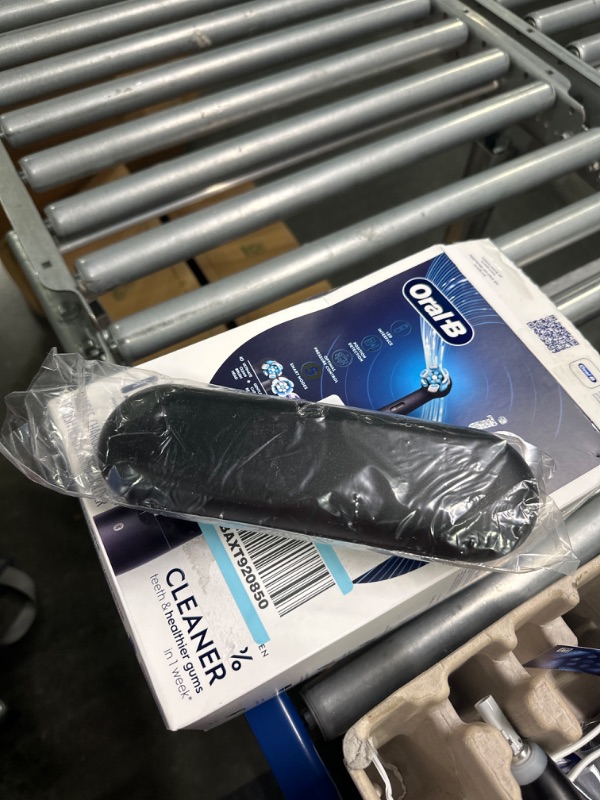 Photo 1 of Oral-B iO Series 5 Limited Electric Toothbrush with (3) Brush Head, Rechargeable, Black Black 1 Count (Pack of 1)