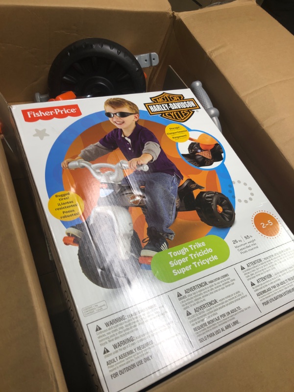 Photo 3 of Fisher-Price Harley-Davidson Tricycle with Handlebar Grips and Storage Area, Multi-Terrain Tires, Tough Trike [Amazon Exclusive]