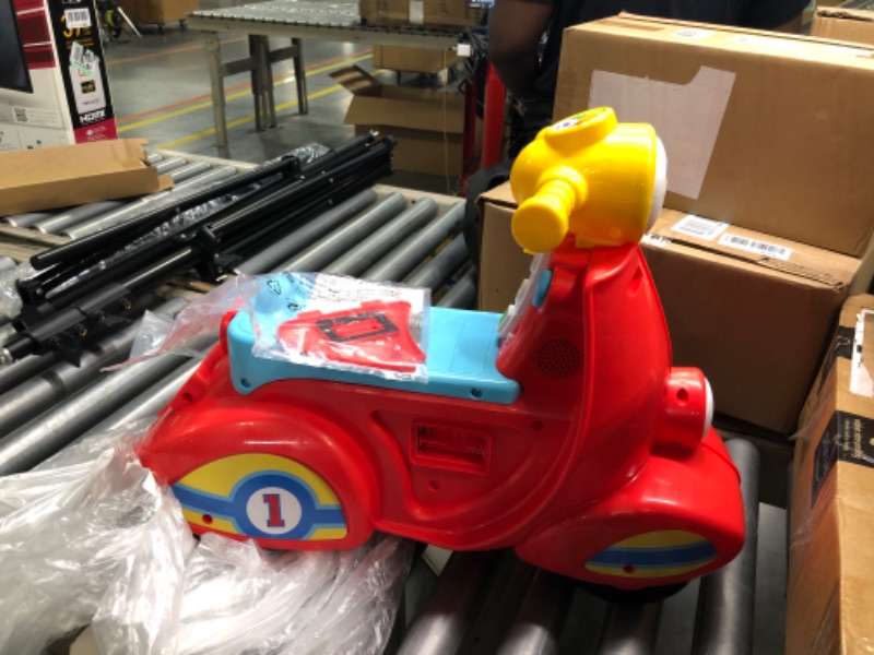 Photo 3 of Fisher-Price Laugh & Learn Smart Stages Scooter, Musical Ride-on Toy with Smart Stages Learning Content for Toddlers Ages 1 to 3 Years & Laugh & Learn Pull & Play Learning Wagon, Ages 6 Months +