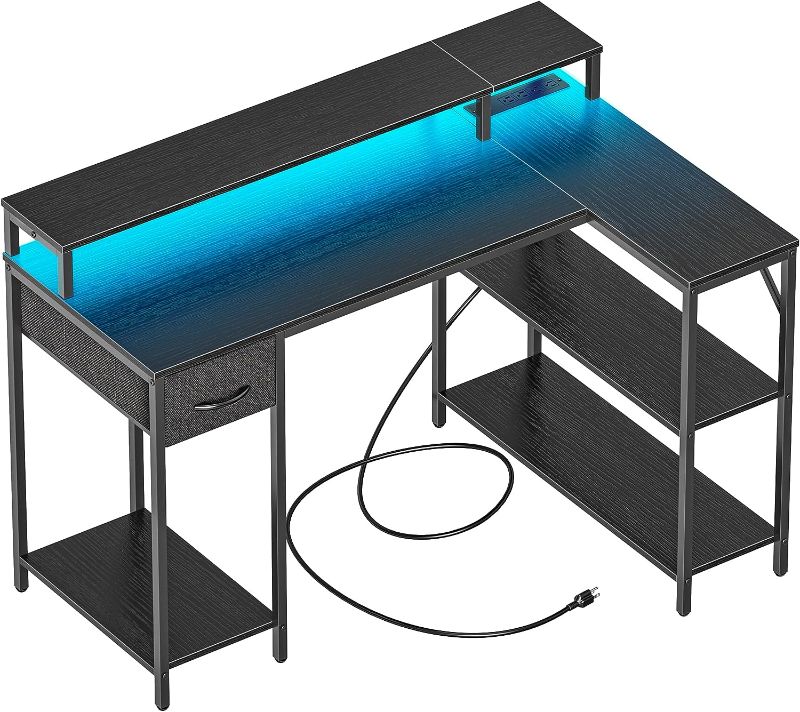 Photo 1 of SUPERJARE L Shaped Gaming Desk with LED Lights & Power Outlets, Reversible Computer Desk with Shelves & Drawer, Corner Desk Home Office Desk, Black
