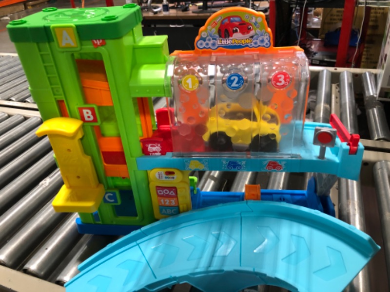 Photo 1 of Fisher-Price Little People Toddler Playset Light-Up Learning Garage with Smart Stages Plus Toy Car and Ramp for Ages 1+ Years Simplified Packaging