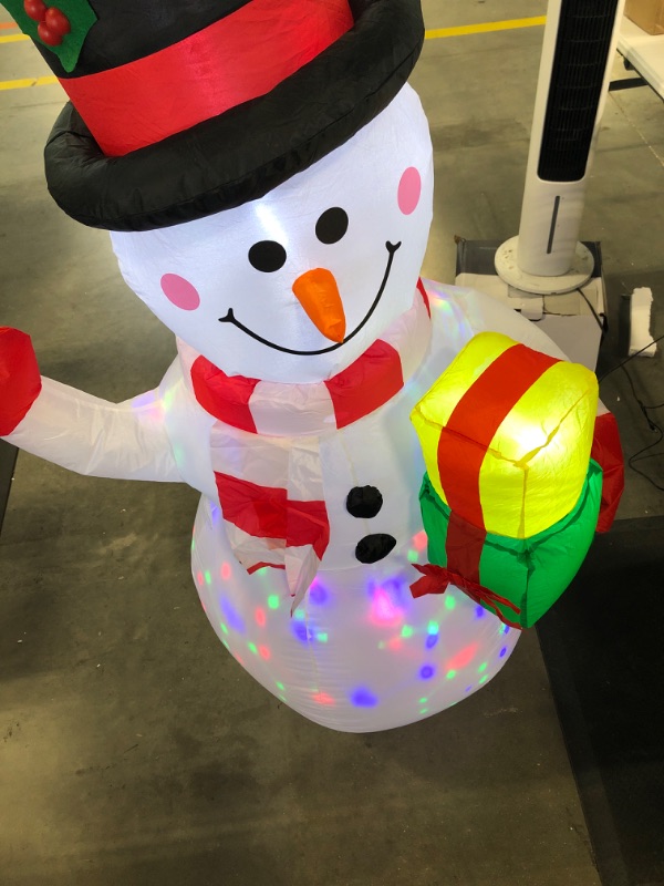 Photo 2 of ***MISSING STAKES*** 5FT Christmas Inflatables Snowman Outdoor Decorations, Blow Up Snowman Inflatable Yard Decor with Rotating LED Lights for Xmas Garden Lawn Holiday Party Yard Indoor Decorations