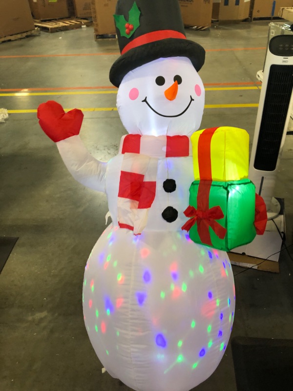 Photo 3 of ***MISSING STAKES*** 5FT Christmas Inflatables Snowman Outdoor Decorations, Blow Up Snowman Inflatable Yard Decor with Rotating LED Lights for Xmas Garden Lawn Holiday Party Yard Indoor Decorations