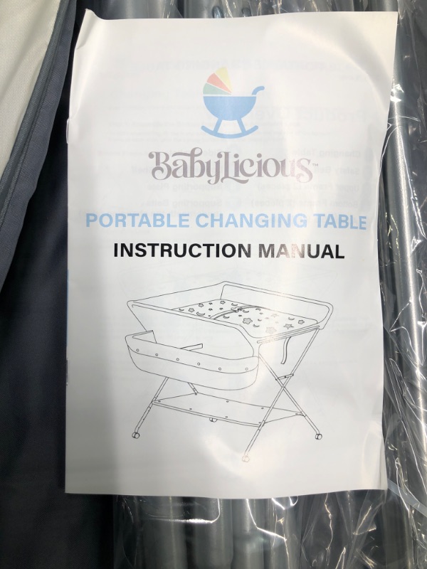 Photo 1 of Babylicious Baby Portable Changing Table - Foldable Changing Table with Wheels - Portable Diaper Changing Station - Adjustable Height Baby Changing Table-Safety Belt and Large Storage Rack for Infants