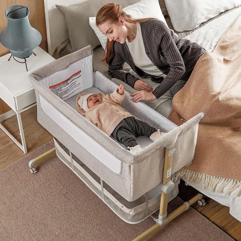 Photo 1 of Baby Bassinet Bedside Sleeper, besrey Bedside Bassinet for Newborn Infant with Comfy Mattress, 9 Height Positions, Adjustable Bedside Crib with 360° Swivel Wheels Bassinet for Baby with Storage Basket
