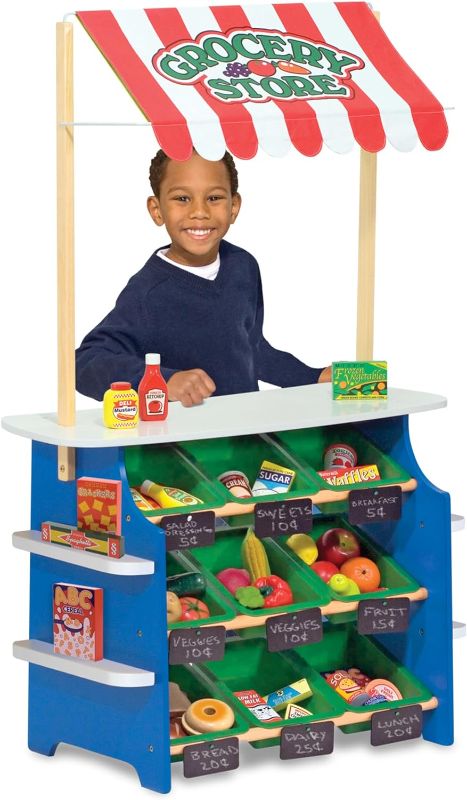 Photo 1 of Melissa & Doug Wooden Grocery Store and Lemonade Stand - Reversible Awning, 9 Bins, Chalkboards
