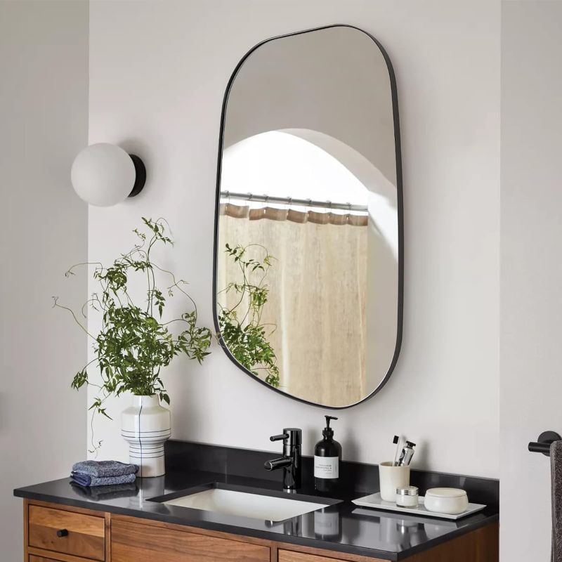 Photo 1 of ANDY STAR Irregular Mirror, Matte Black Bathroom Mirror Stainless Steel Framed Asymmetrical Mirror for Living Room Bathroom Bedroom Entryway Decorative Mirror Irregular Wall Mirror 24x36”
