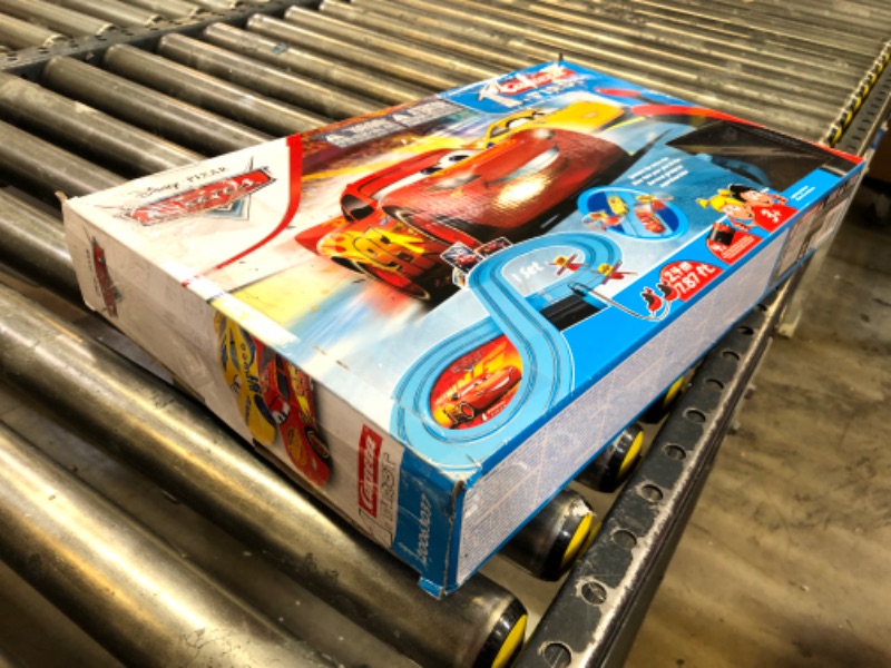 Photo 3 of Carrera First Disney/Pixar Cars - Slot Car Race Track - Includes 2 Cars: Lightning McQueen and Dinoco Cruz - Battery-Powered Beginner Racing Set for Kids Ages 3 Years and Up Disney Cars w/ Spinners